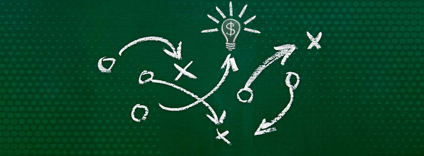 financial literacy month blog post header image is a chalk drawing sports play x and o and arrows pointing to dollar sign